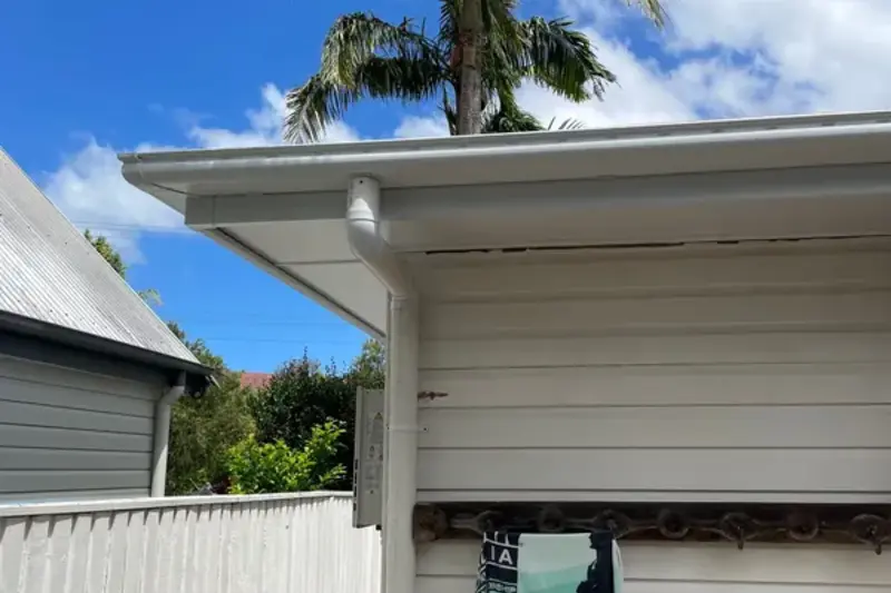 Fresh fascia and guttering detail on a home eave